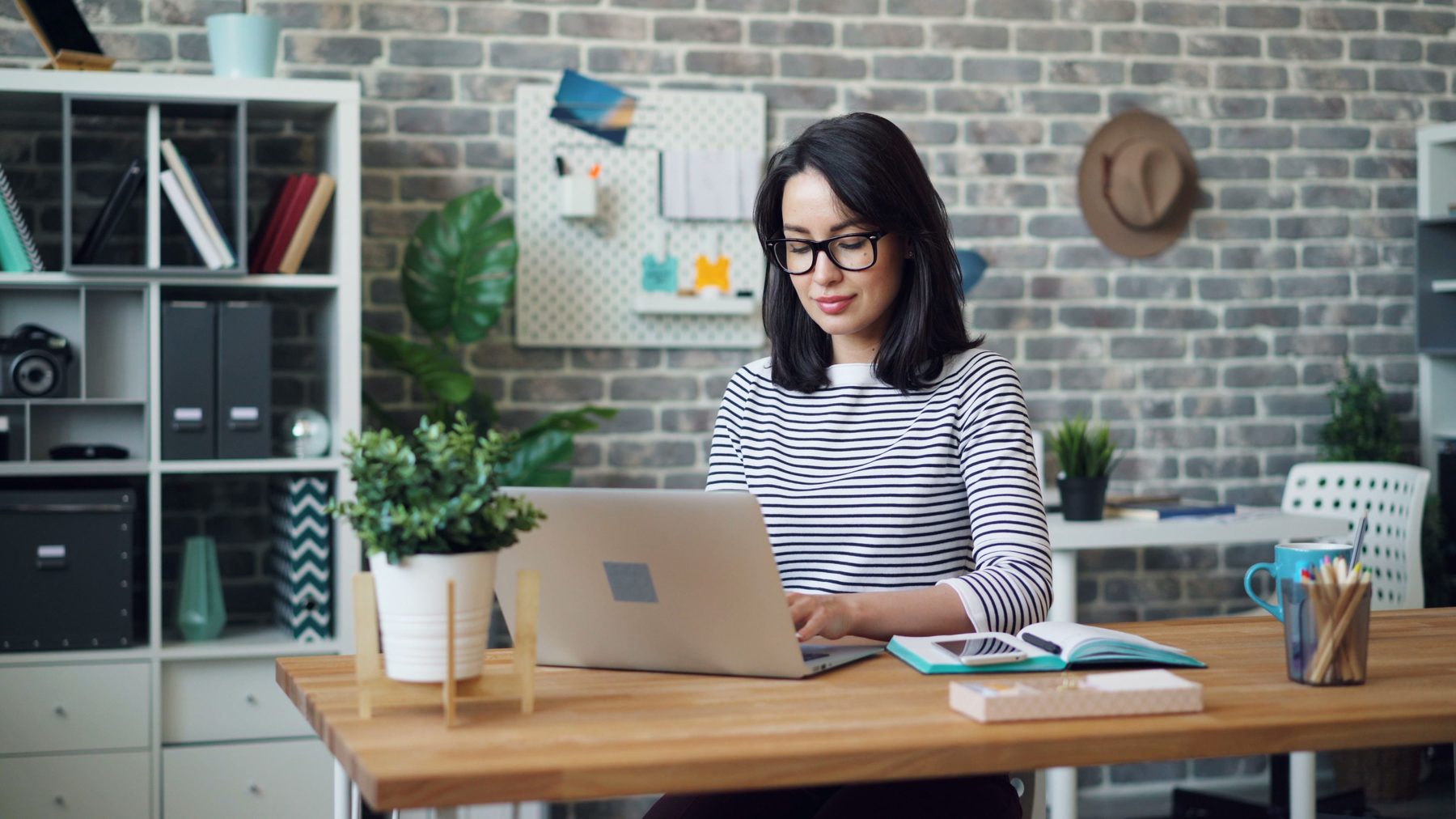 Product editor researching technology at a laptop